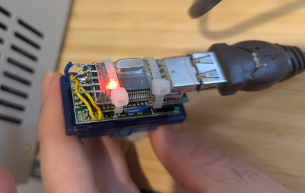 An image showing the modified OBD-II adapter prior to applying hot glue