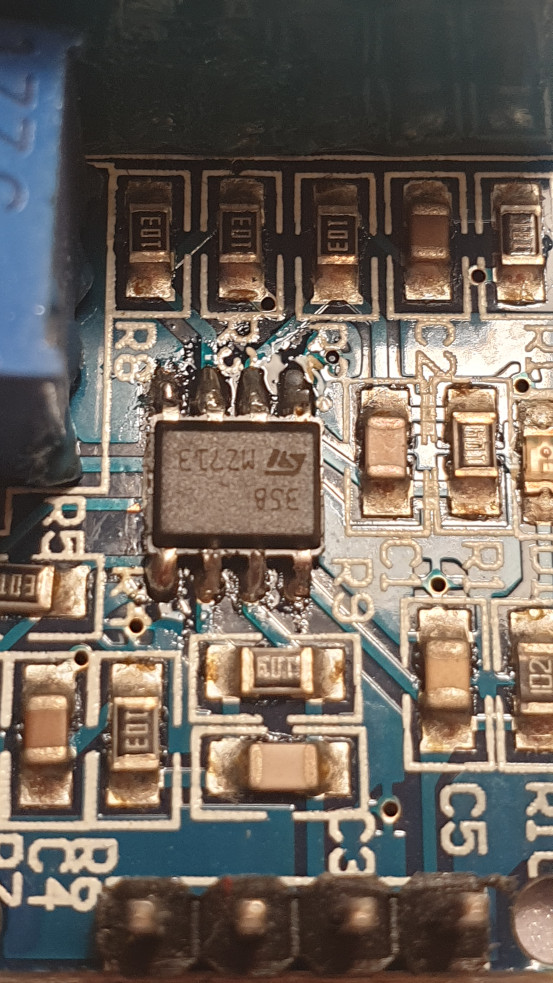 Photo showing the ZMPT101B voltage sensor module with the replcement op-amp soldered.