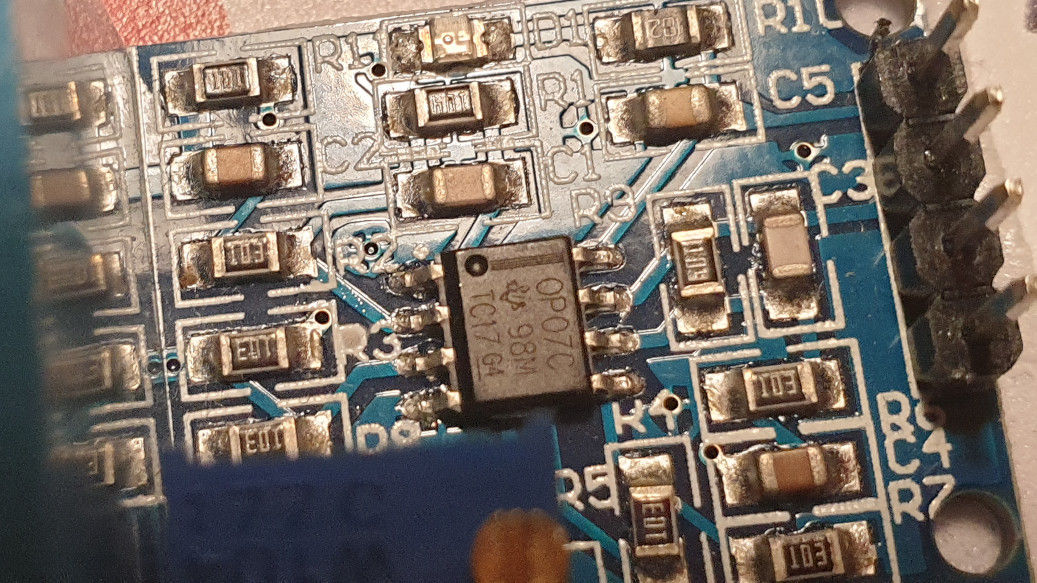 Photo showing the ZMPT101B voltage sensor module with the incorrectd OP07 op-amp installed