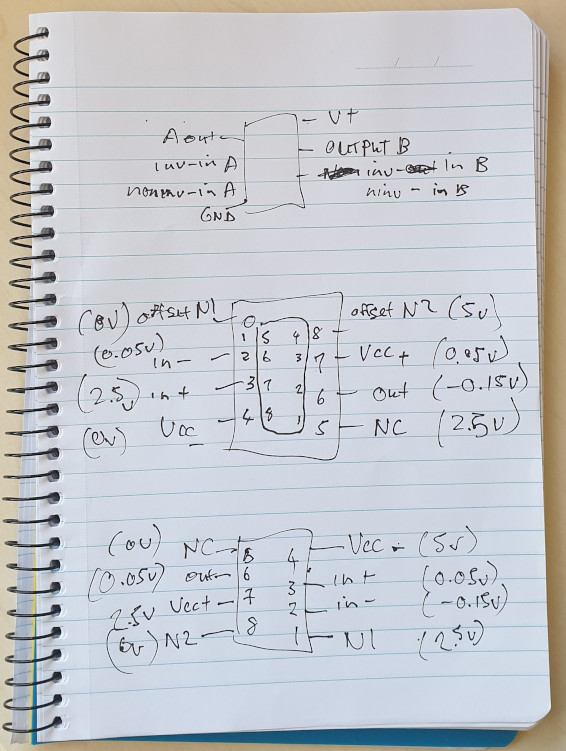 Photo of a note-book showing SOIC-8 packages with their pinouts and measured voltages